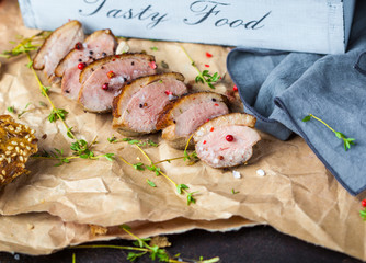 Baked sliced duck with a crust.