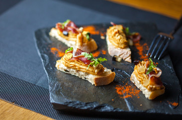 Mini sandwiches with pate in the restaurant. Restaurant food concept.
