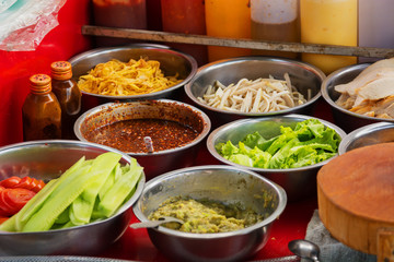 Ingredients for a salad in the outdoor dining area. Laos