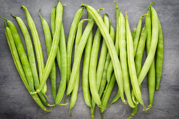 Green beans  on a gray background.