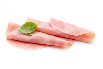 Thin slices of ham on white background.