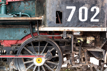 Steam locomotive wheels and mechanics closeup