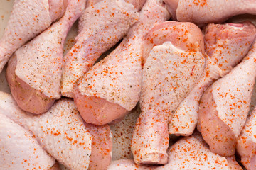 Fresh chicken leg,  meat on plate.With spices.
