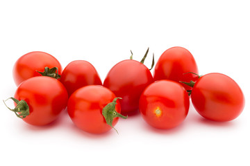 Small plum tomatoes on a white background.