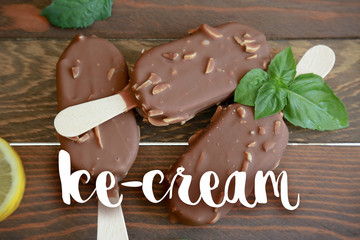 ice cream with chocolate on wooden background