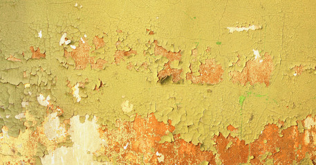Dirty background - wall of abandoned building with damaged green paint