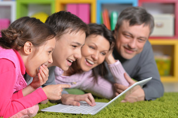 Fototapeta premium Big family lying on floor 