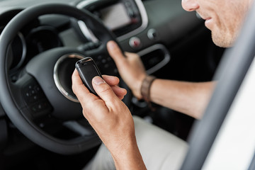 Male arm holding digital device