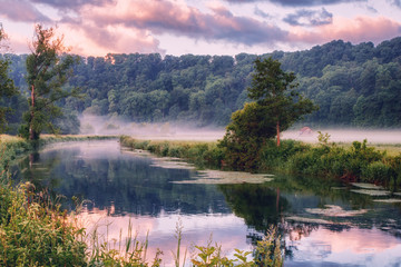 Fototapeta na wymiar Early morning impression at the Brenz river in the Eselsburger Valley (Eselsburger Tal) near Herbrechtingen, Germany. Beauty of nature concept. Artistic style post processed photo.