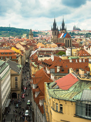 Obraz premium prague, view over tyn church with saint vit cathedral in the background taken from powder tower 