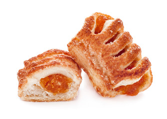 Puff pastry close-up with jam isolated on white