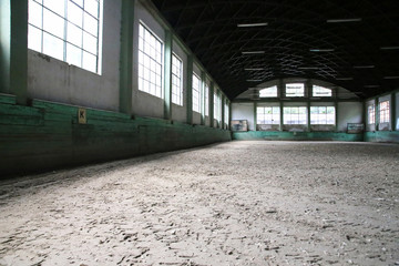 Empty riding arena is suitable for dressage horses