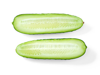 Fresh cucumber halves (Cucumis sativus), parallel, top view. Isolated on white background