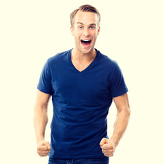 Fototapeta premium Cheerful young man, on yellow