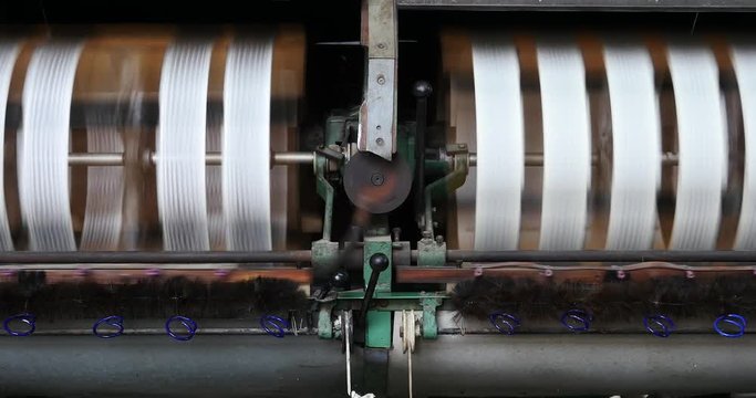 4k Machine Producing Tissues In A Silk Factory,Spinning Machine Collect silk Threads,silk textile factory production line,Workers reeling at workshop.