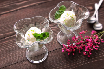 Vanilla ice creame in glasses and pink flowers