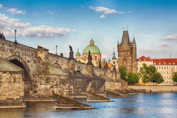 Prague, Czech Republic famous view with historic Charles Bridge and Vltava river during nice summer day