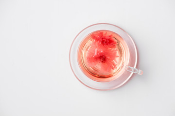 Cherry blossom (sakura) Japanese Herb tea on white background.