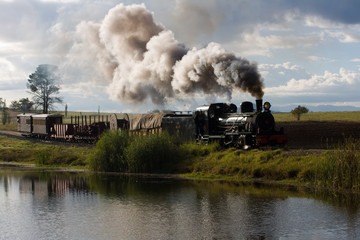 Fototapeta na wymiar steam train at sandstone estates in south africa