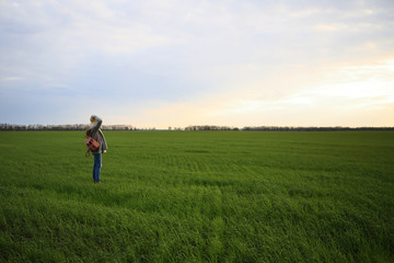 Naklejka na ściany i meble Girl in the field, greens, grass, nature, sunset, sky, inspiration, outdoors