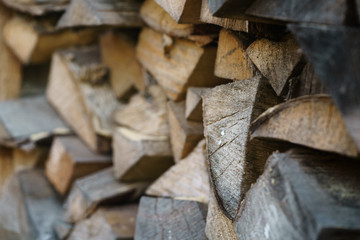 natural firewood stack rustic background closeup, chopped wood