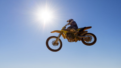 Obraz na płótnie Canvas Motocross Racer Jumping