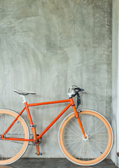 Fototapeta na wymiar orange bicycle parked decorate interior living room modern style