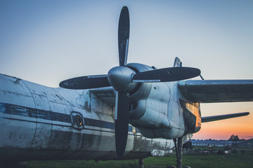 An old, abandoned plane. Chassis. Propeller. Wing