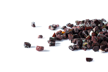 beautiful natural stone burgundy spilled on a white background