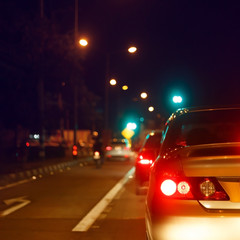 tail light of back car on urban street road