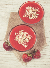 Strawberry smoothie with fresh fruit .