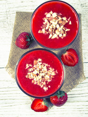 Strawberry smoothie with fresh fruit .