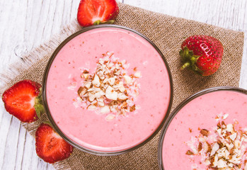 Strawberry smoothie with fresh fruit .