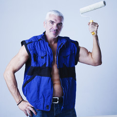 young strong handsome man builder with muscular athletic strong body