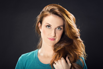 Fototapeta premium Portrait of a beautiful woman with red hair