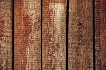 Vertical wide boards  in the sunlight. Wooden texture.