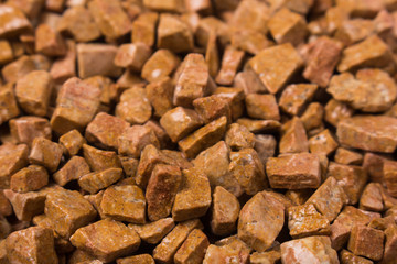 beautiful natural red stone scattered on a white background