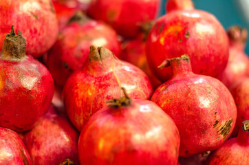 Fresh raw pomegranates fruit on market stall in Malaysia.Selective focus shot