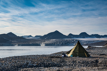 Campsite tents in Svalbard at glacier front tongue