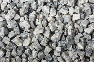 beautiful natural gray stones scattered on a white background
