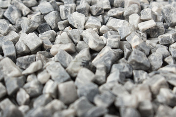 beautiful natural gray stones scattered on a white background