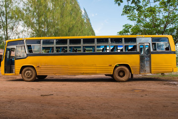 Fototapeta na wymiar A Yellow school bus parked outdoor .