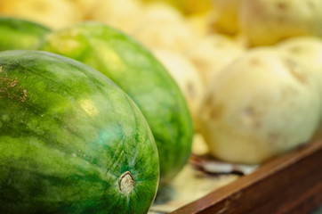 Fresh raw red watermelon on market stall.