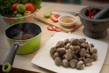 Fresh Cockles in the dish with Vegetables and ingredient prepare for seafood sauce Scald cockles / Selective focus and Still Life food image.