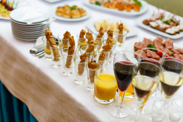 Delicious buffet table at a luxury event spread with a variety of cold meat platters and fresh colorful salad and vegetables