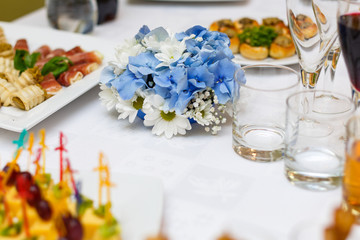 Delicious buffet table at a luxury event spread with a variety of cold meat platters and fresh colorful salad and vegetables