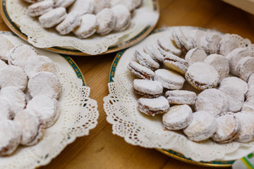 alfajores freshly baked cookies closeup on a plate on the table. horizontal