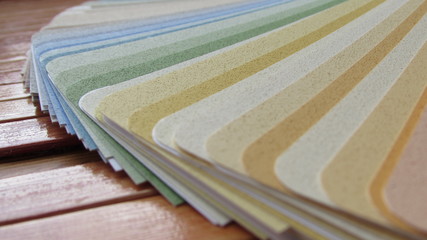 a stack of colored paper, folded cardboard