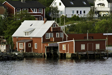 Fototapeta na wymiar Waterfront houses in Floro, on Brandsoya island, Norway