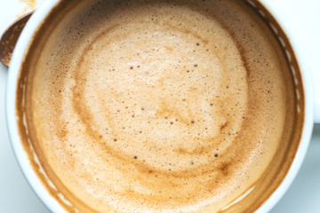 Close up image of hot coffee in white muck